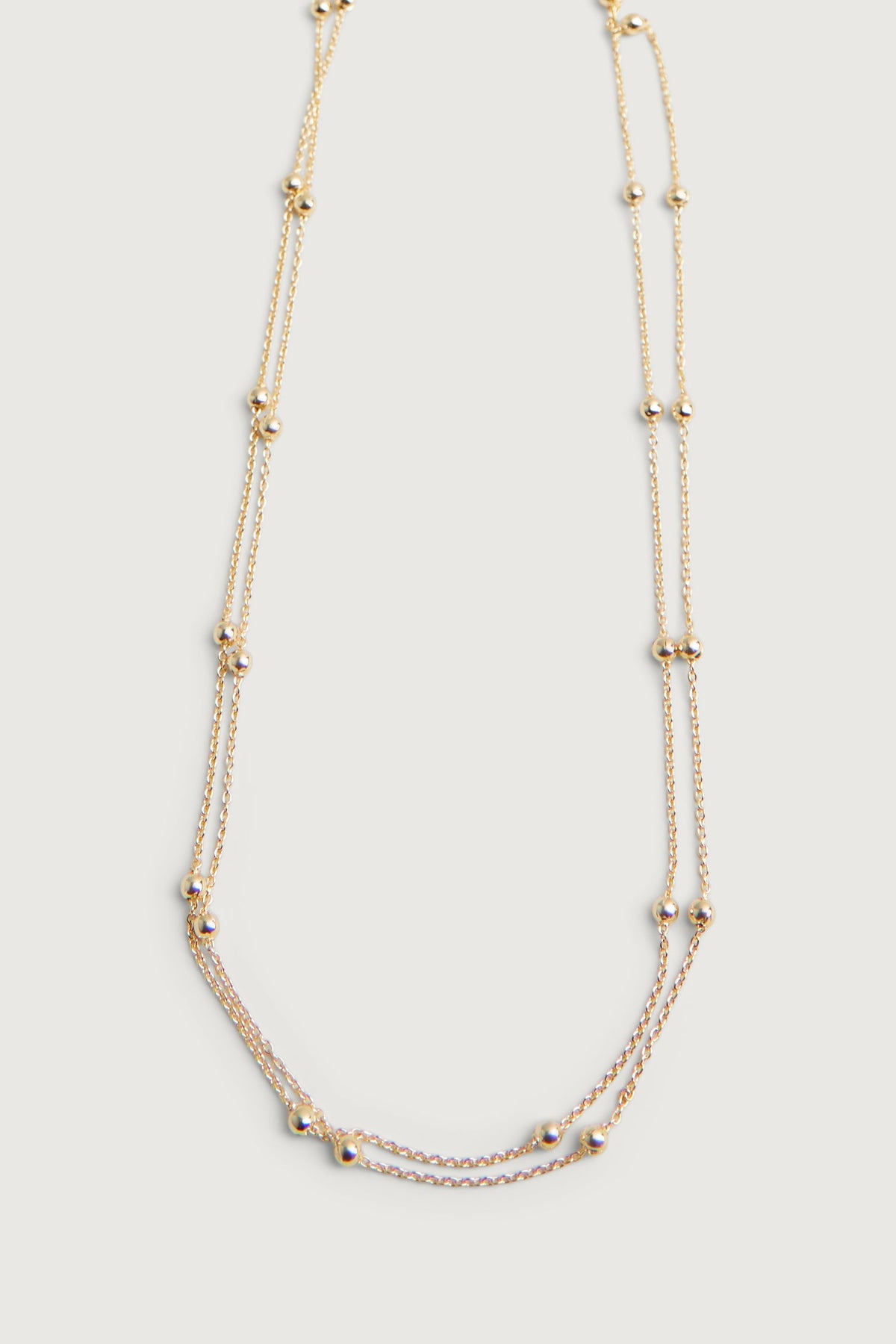 LAYERED BEADED NECKLACE