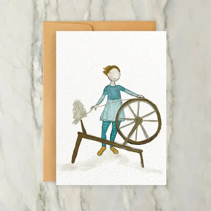 Person in Blue Dress at a Spinning Wheel