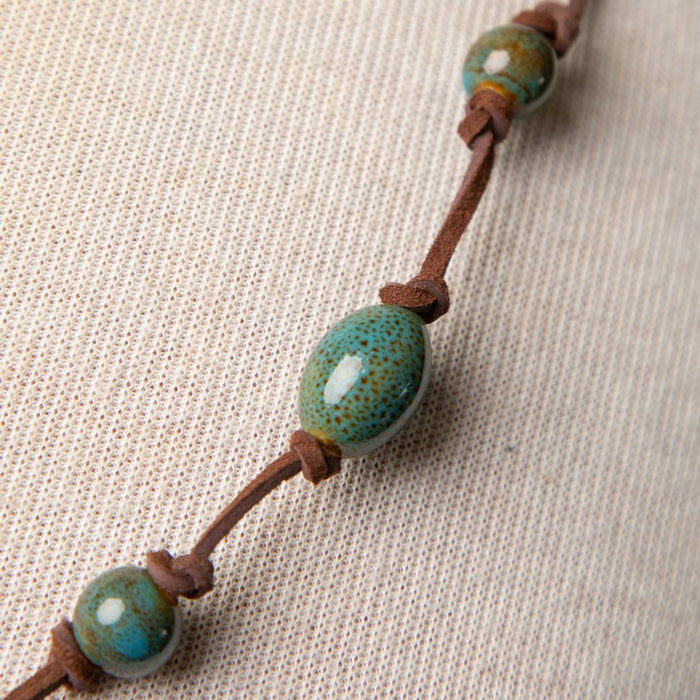 Jennifer's Unisex Leather and Ceramic Trinity Knot Necklace